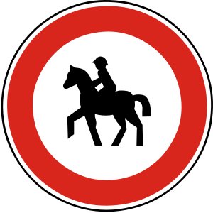 Značka B 12 - Zákaz vjazdu jazdcov na koňoch - zakazuje vjazd jazdcom na koňoch; zákaz sa vzťahuje aj na prípady, ak je kôň vedený osobou za uzdu alebo za vodidlo.